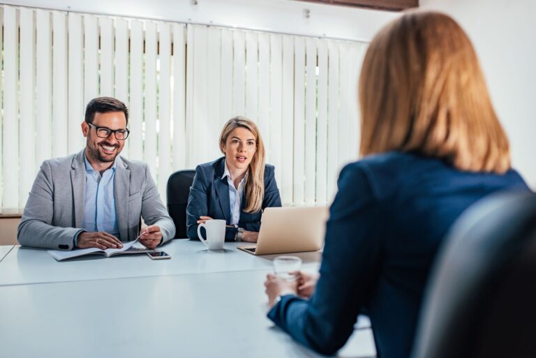 Business - young woman sitting in job interview.